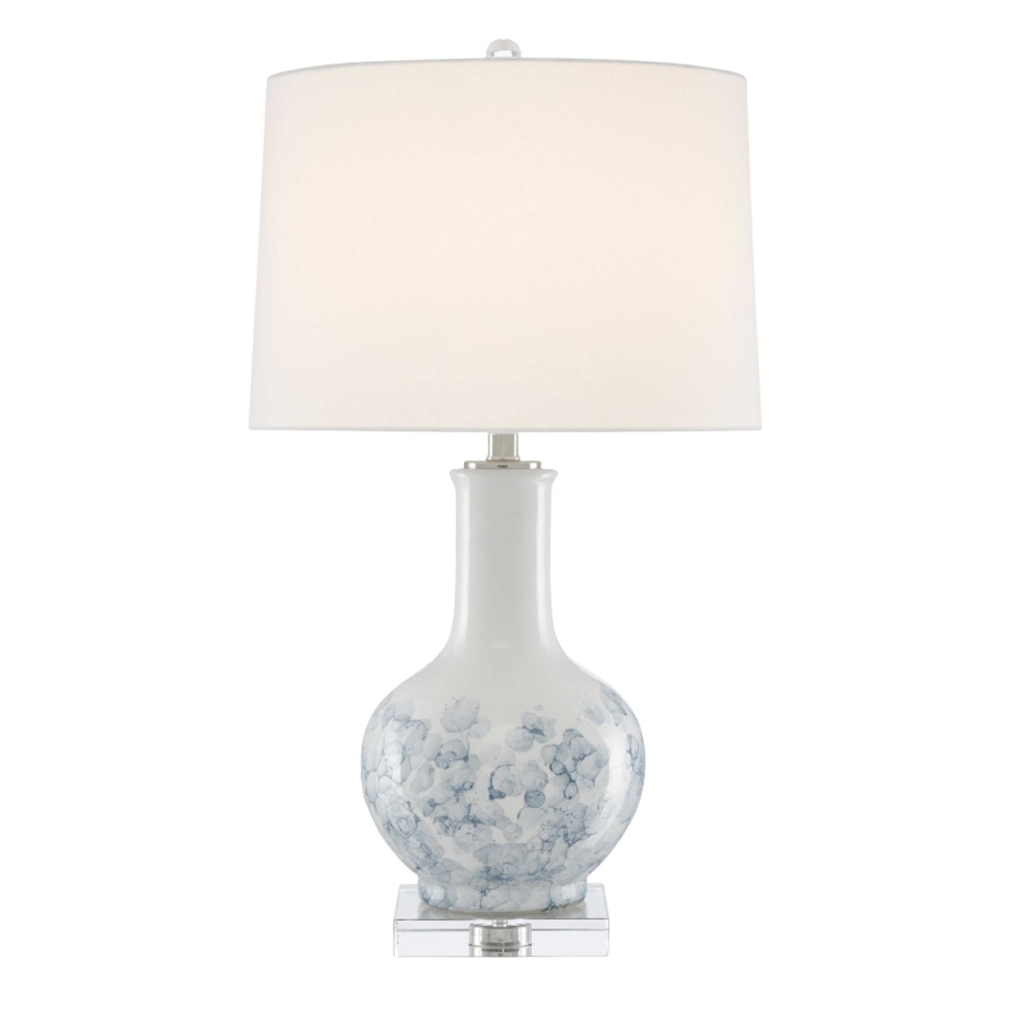 Table lamp with white shade and decorative base on a white background