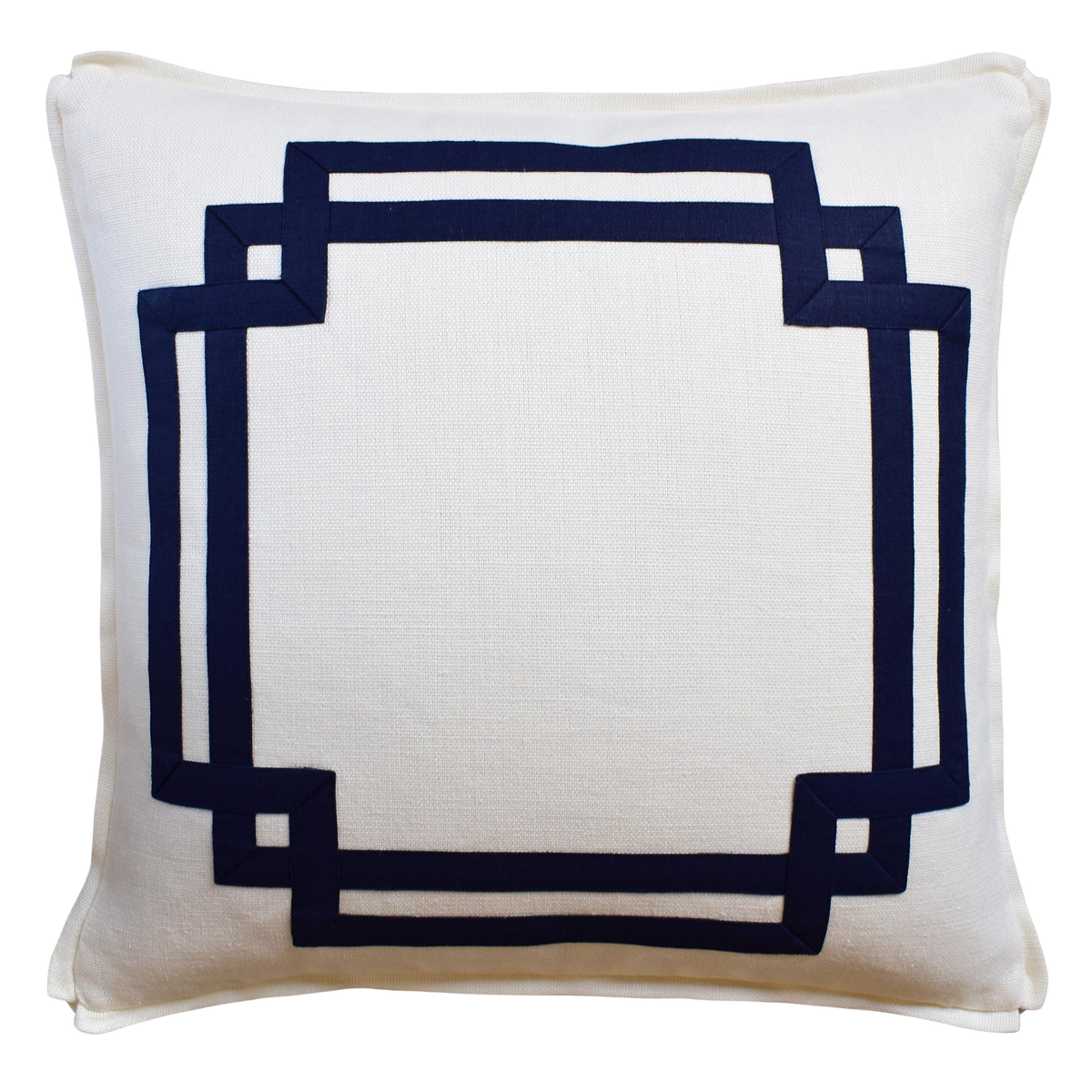 White pillow with a navy blue geometric border on a white background