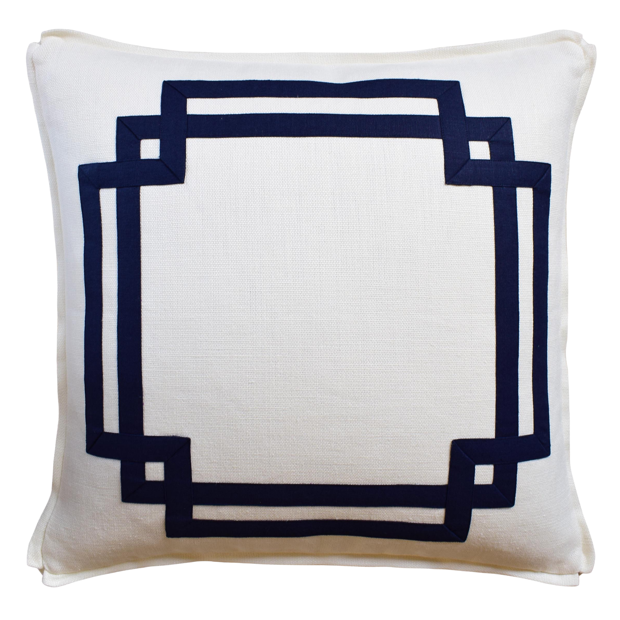 White pillow with a navy blue geometric border on a white background