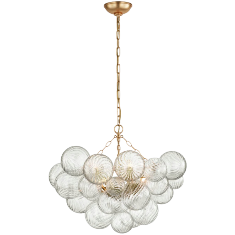 A chandelier with a gold-colored metal structure and clear glass orbs.