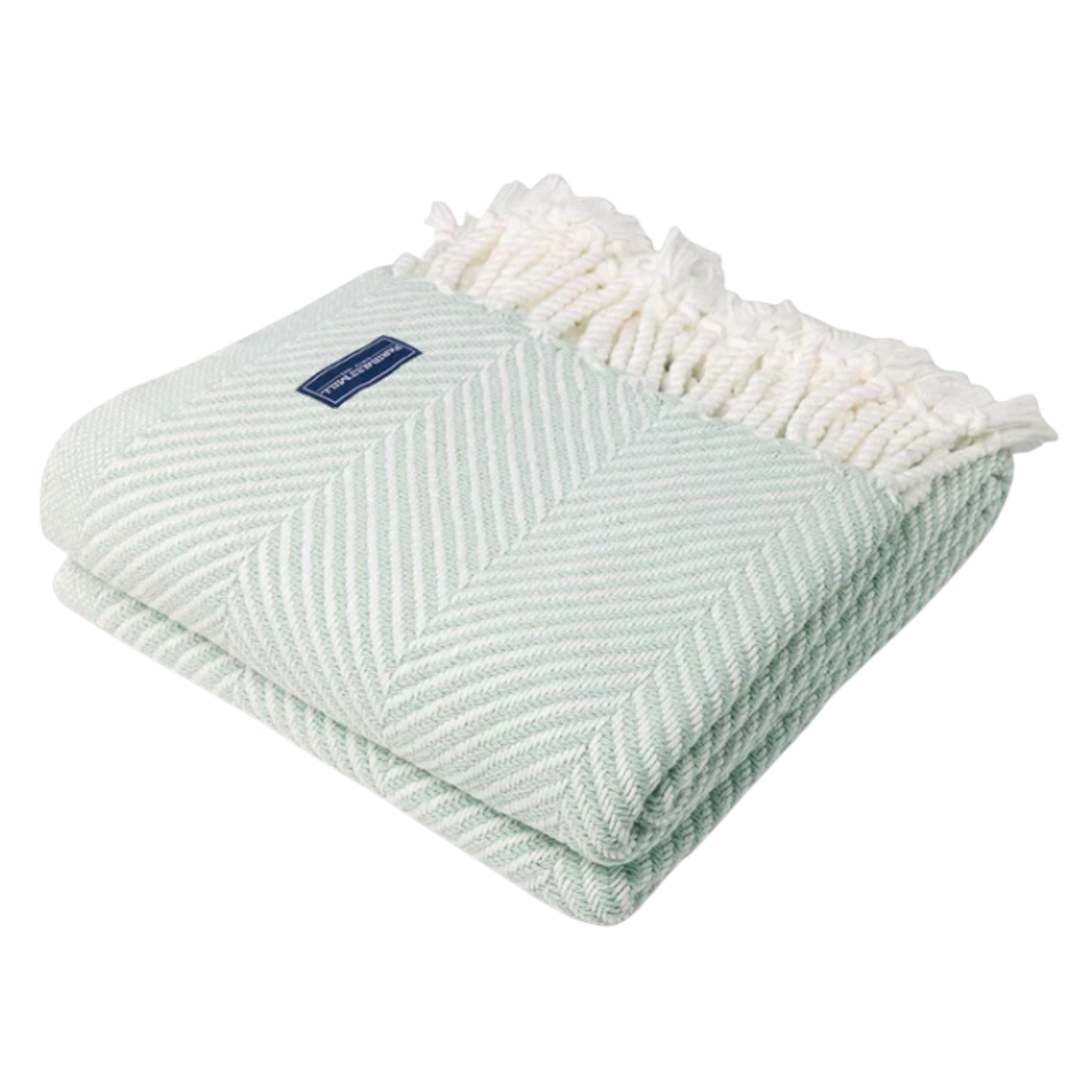A green and white striped cotton throw with a herringbone pattern and fringe detail.